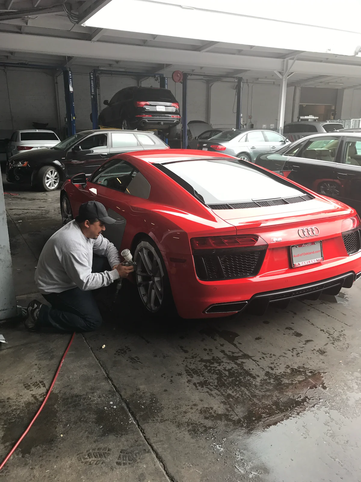 technician repairing an Audi R8 wheel